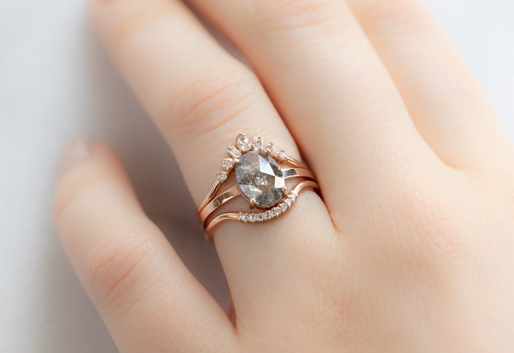 The Bryn Ring with an Oval-Cut Salt and Pepper Diamond with White Diamond Stacking Bands on Model