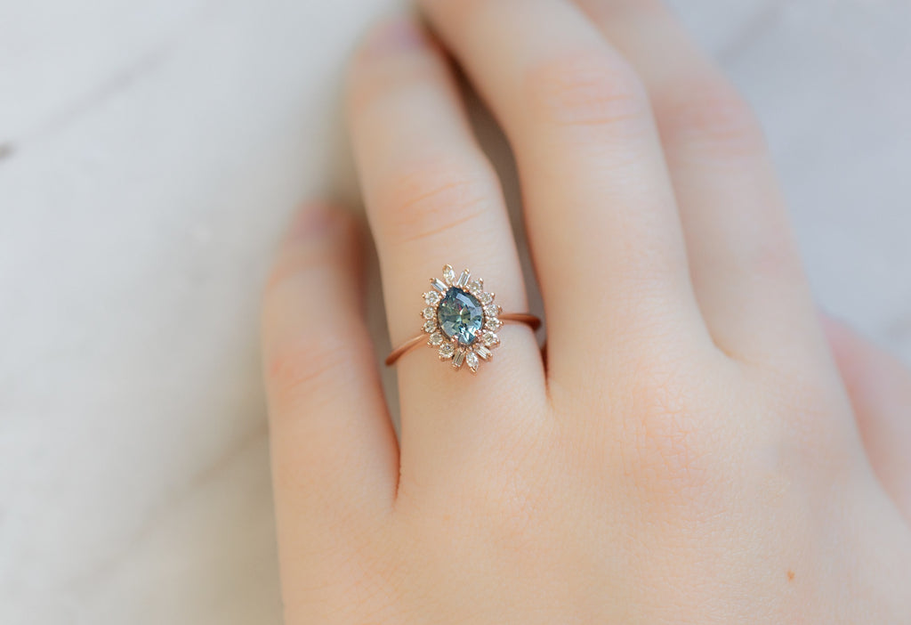 The Camellia Ring with a Bicolor Marquise Sapphire on Model