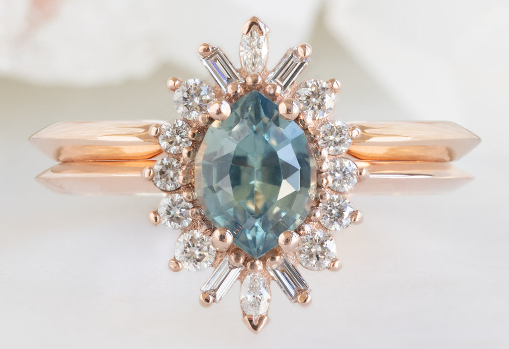 The Camellia Ring with a Bicolor Marquise Sapphire with Knife-Edge Stacking Band