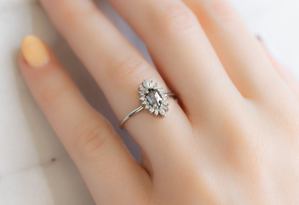 The Camellia Ring with a Black Hexagon Diamond on Model