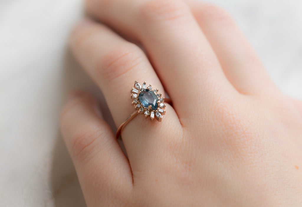 The Camellia Ring with a Montana Sapphire Hexagon on Model
