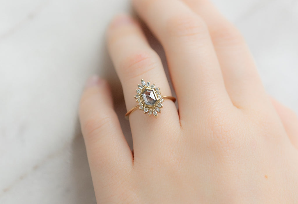The Camellia Ring with a Salt and Pepper Hexagon Diamond on Model