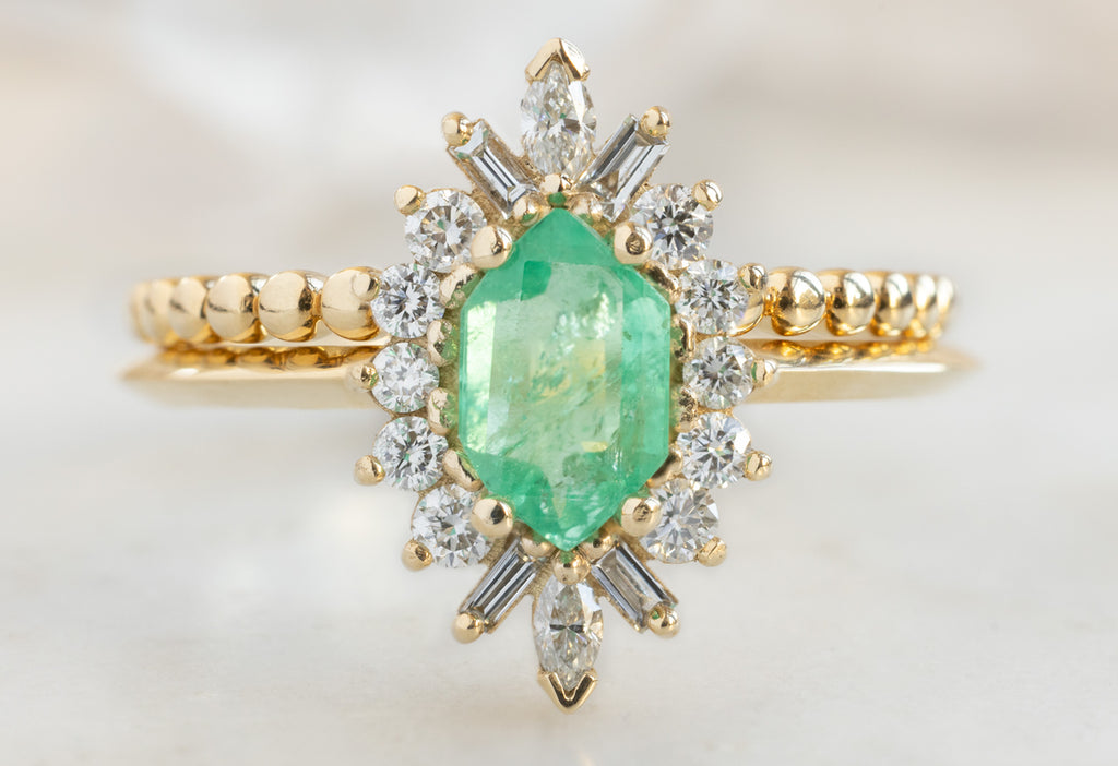 The Camellia Ring with an Emerald Hexagon with Beaded Stacking Band