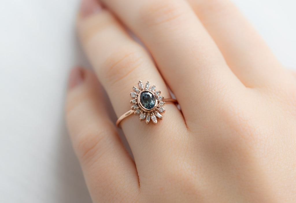 The Camellia Ring with an Oval-Cut Montana Sapphire on Model