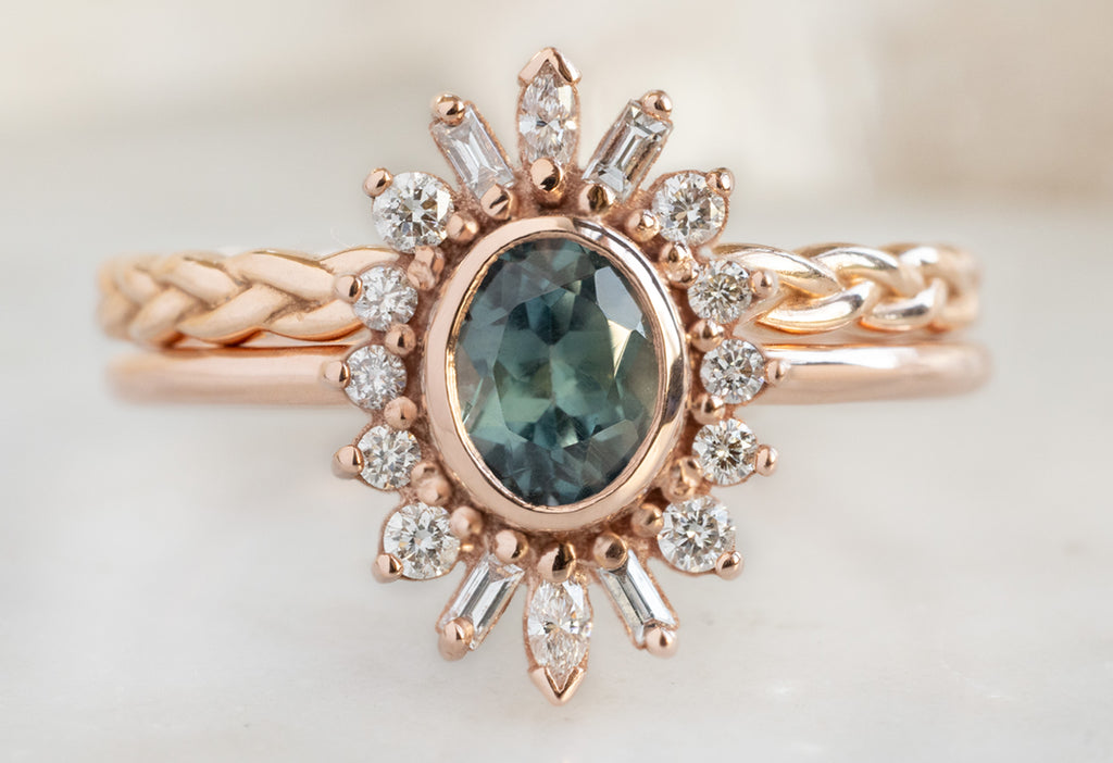 The Camellia Ring with an Oval-Cut Montana Sapphire with Braided Stacking Band