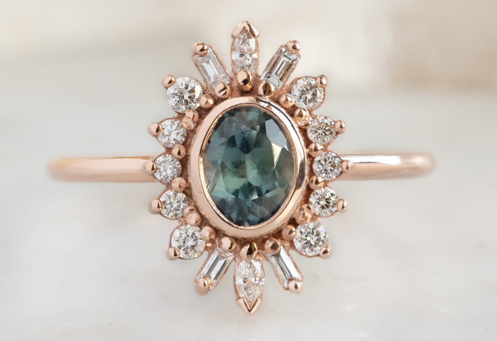 The Camellia Ring with an Oval-Cut Montana Sapphire