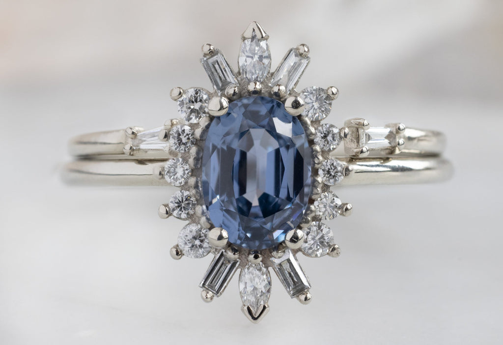 The Camellia Ring with an Oval-Cut Spinel with Open Cuff Baguette Stacking Band