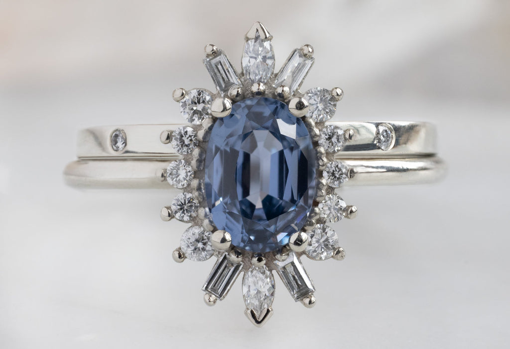 The Camellia Ring with an Oval-Cut Spinel with Diamond Eternity Band