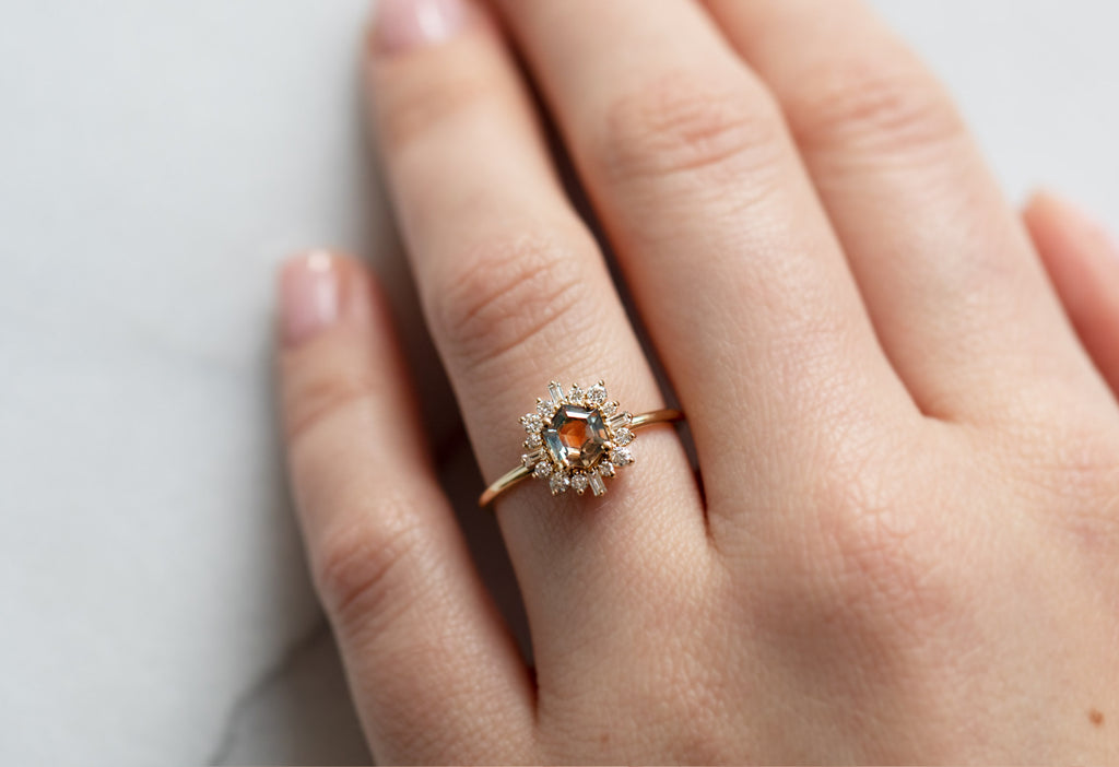 The Compass Ring with a Bicolor Montana Sapphire on Model