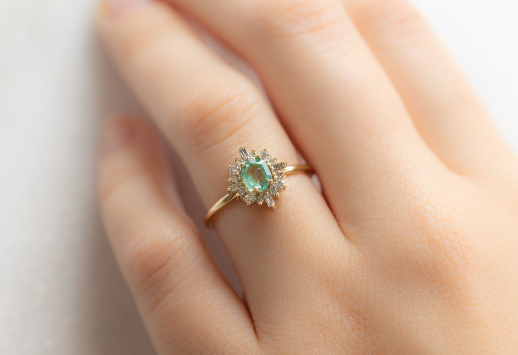 The Compass Ring with an Emerald Hexagon on Model