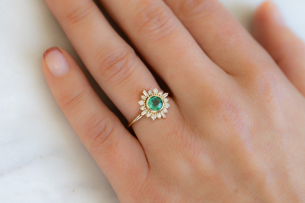 The Compass Ring with a Round-Cut Emerald on Model