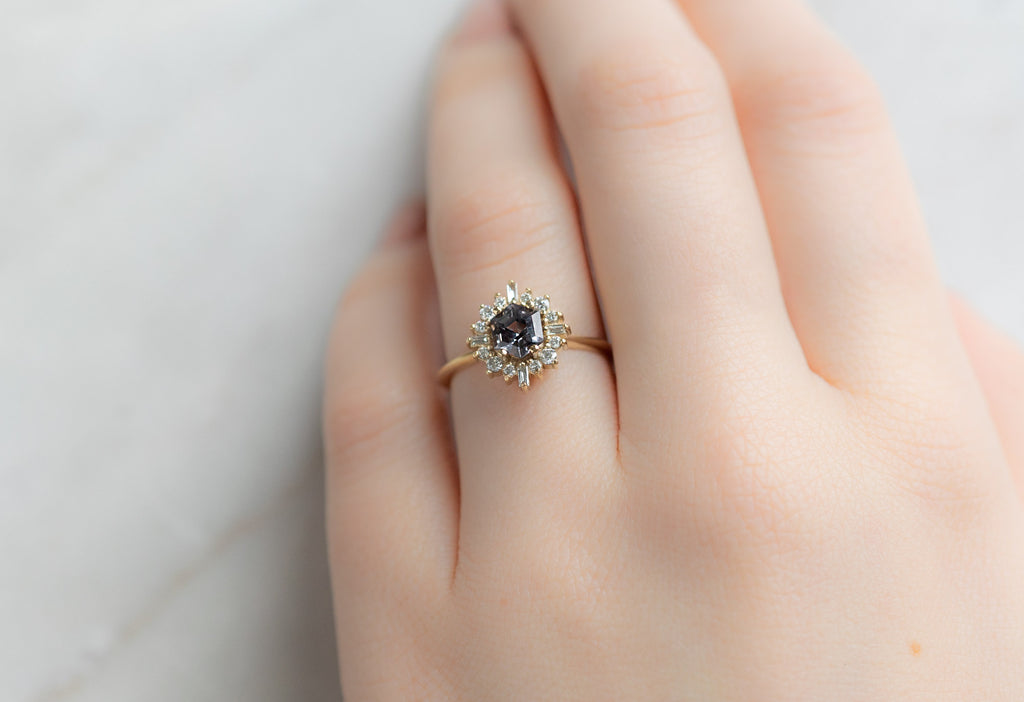The Compass Ring with a Violet Grey Spinel on Model