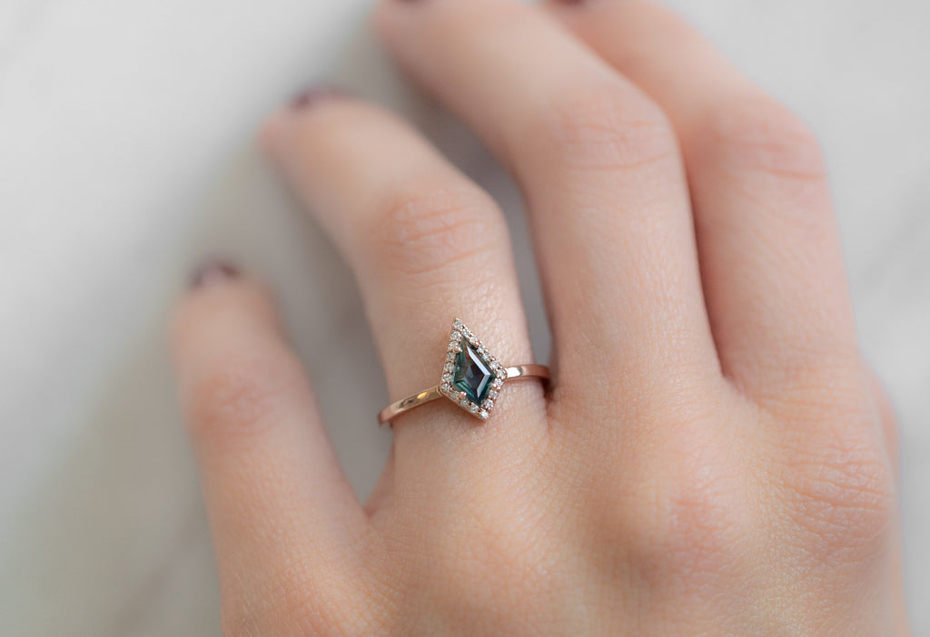 The Dahlia Ring with a Kite-Shaped Montana Sapphire on Model