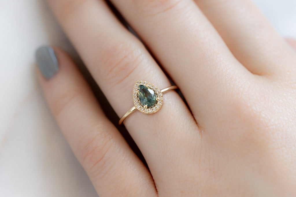 The Dahlia Ring with a Pear-Cut Montana Sapphire on Model