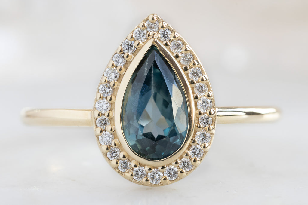 The Dahlia Ring with a Pear-Cut Sapphire