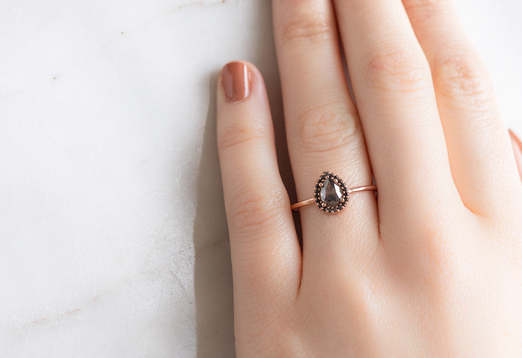 The Dahlia Ring with a Rose-Cut Black Diamond on Model