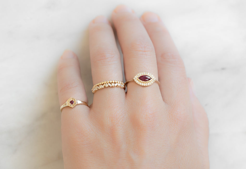 The Dahlia Ring with a Ruby Marquise Stacked on Model as a Right Hand Ring