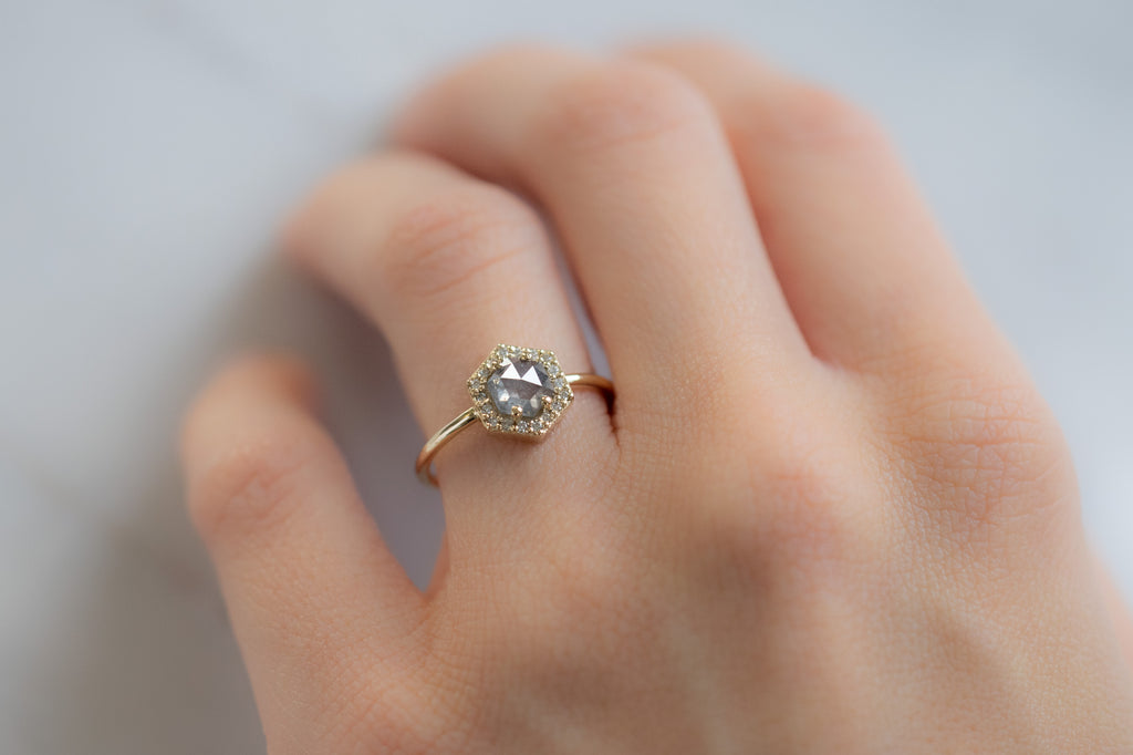 The Dahlia Ring with a Salt and Pepper Hexagon Diamond on Model