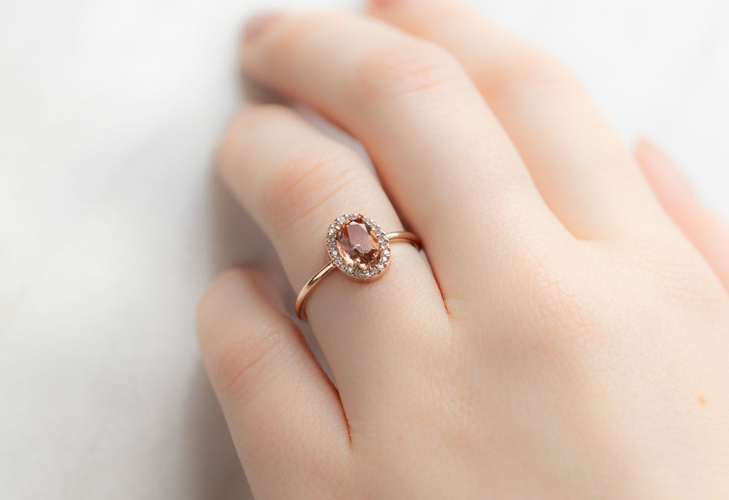 The Dahlia Ring with an Oval-Cut Sunstone on Model