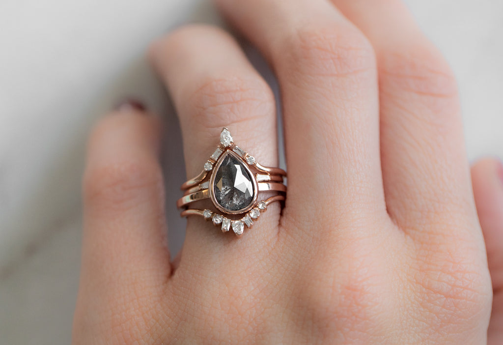 The Hazel Ring with a Rose-Cut Black Diamond with Stacking Bands on Model