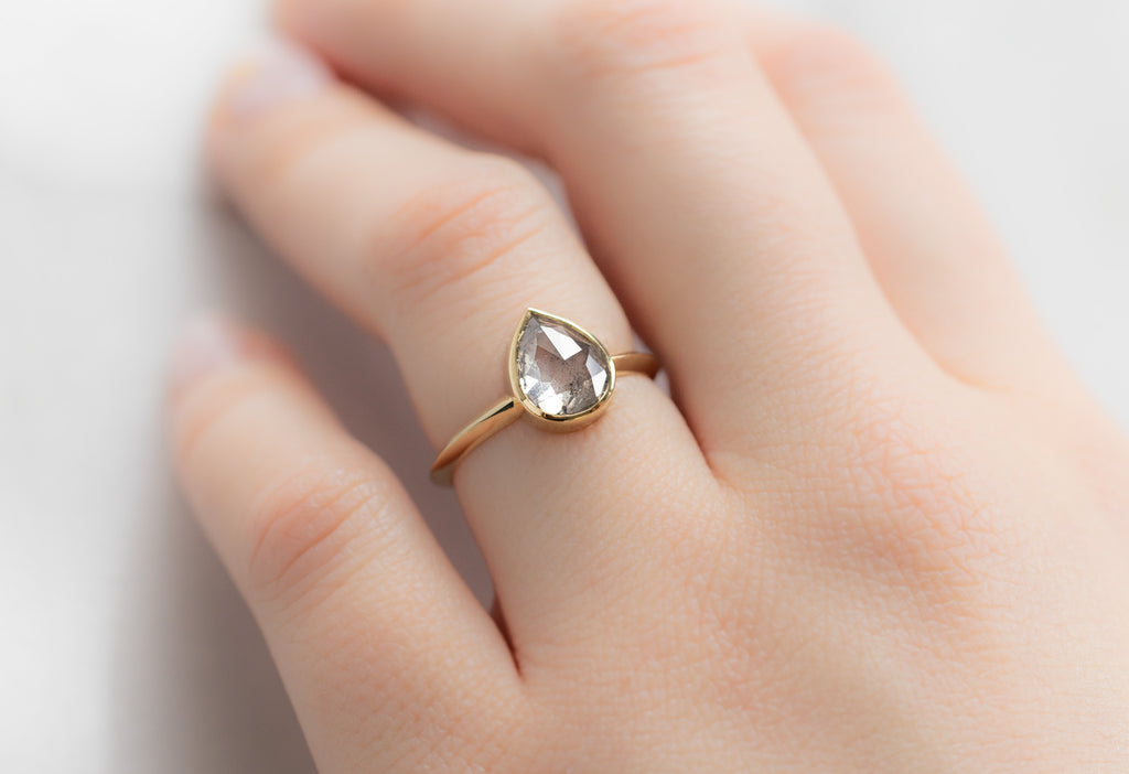 The Hazel Ring with a Rose-Cut Icy White Diamond on Model
