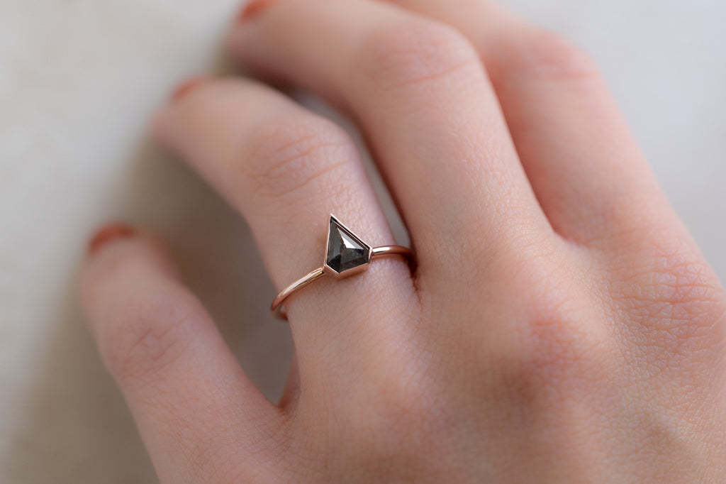 The Hazel Ring with a Shield-Cut Black Diamond on Model