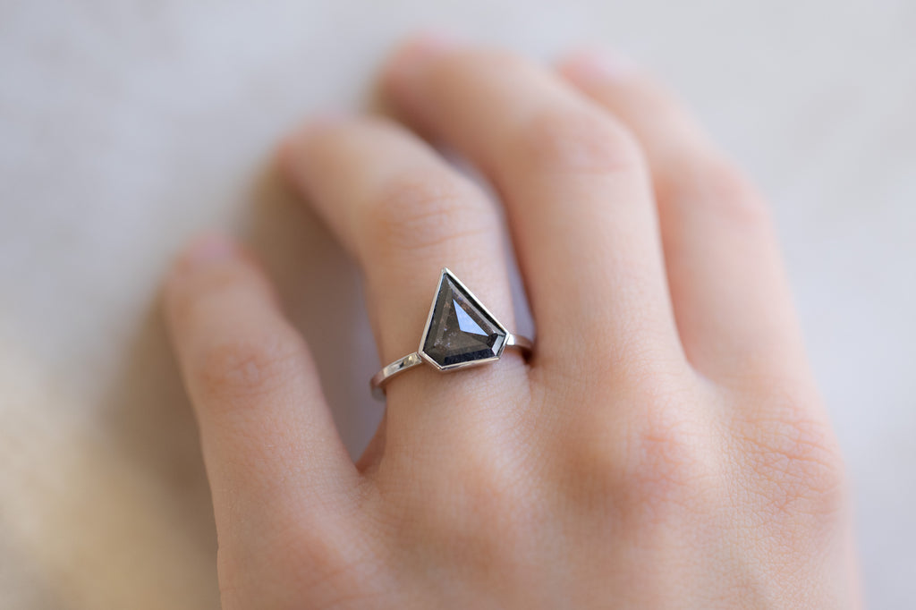 The Hazel Ring with a Shield-Cut Black Diamond on Model