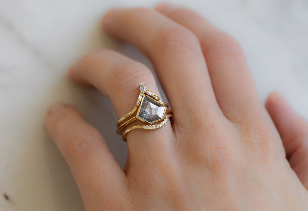 The Hazel Ring with a Shield-Cut Salt and Pepper Diamond with Stacking Bands on Model