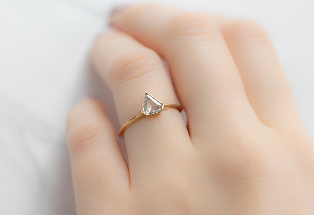 The Hazel Ring with a Shield-Cut White Diamond on Model