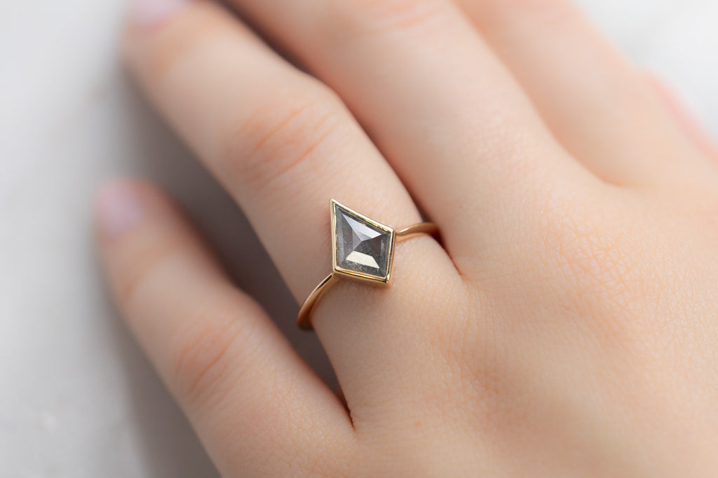 The Hazel Ring with a Silvery Grey Kite Diamond on Model