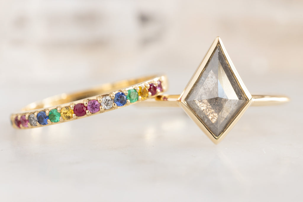The Hazel Ring with a Silvery Grey Kite Diamond with a Rainbow Sapphire Stacking Band