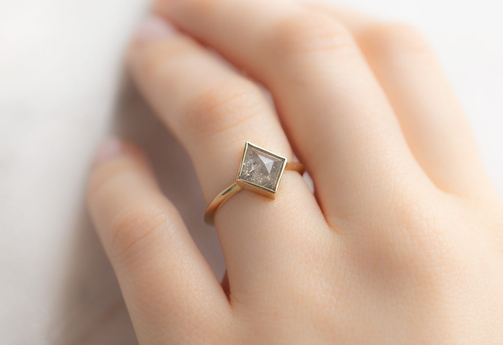 The Hazel Ring with a Silvery Grey Kite-Shaped Diamond on Model