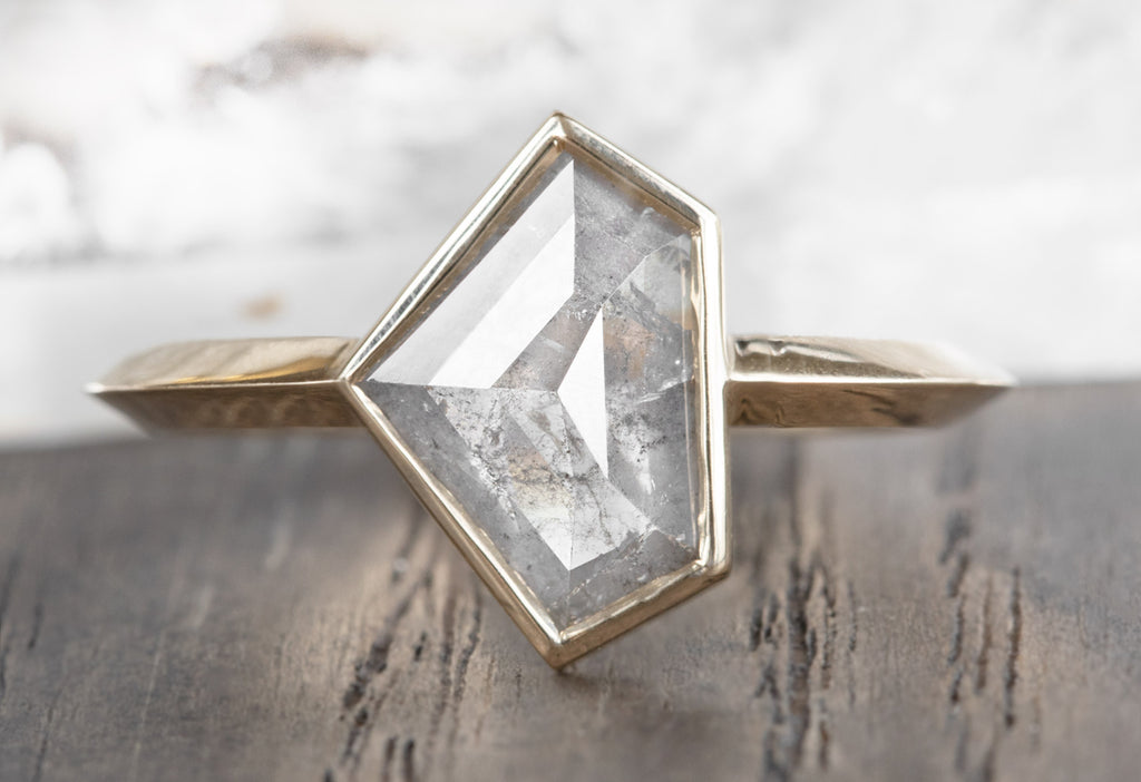 The Hazel Ring with a Silvery-Grey Shield-Cut Diamond
