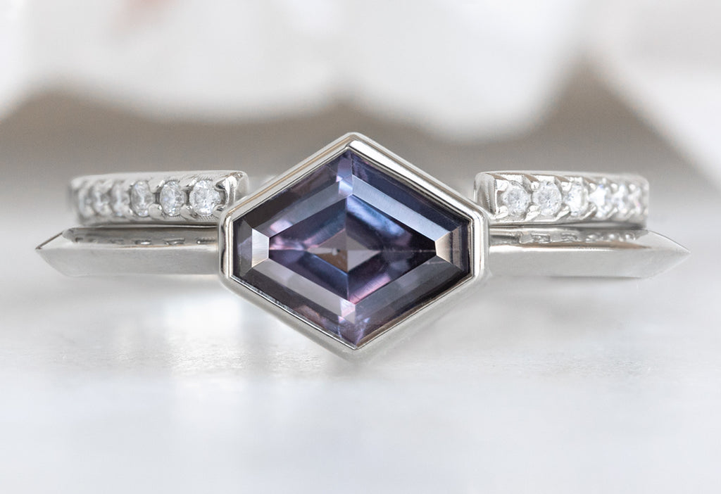 The Hazel Ring with an Artisan-Cut Violet Sapphire with an Open Cuff Pavé Stacking Band