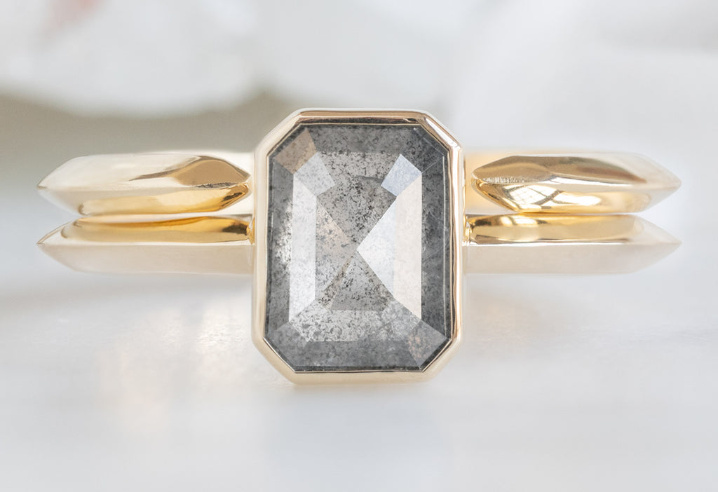 The Hazel Ring with an Emerald-Cut Salt and Pepper Diamond with Open Cuff Knife Edge Stacking Band