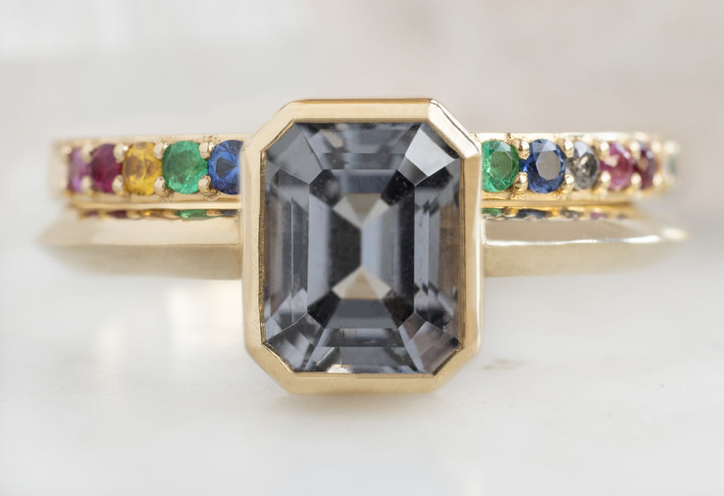 The Hazel Ring with an Emerald-Cut Spinel with Rainbow Sapphire Stacking Band