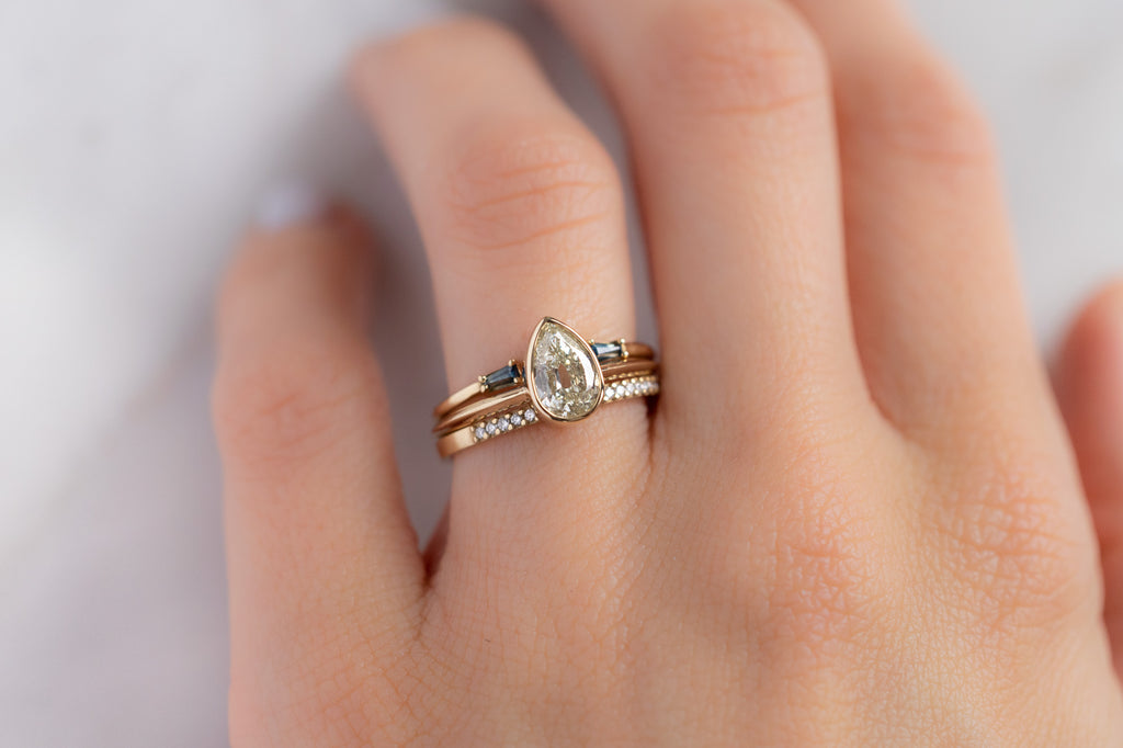 The Hazel Ring with an Old Mine Cut Diamond with Stacking Bands on Model