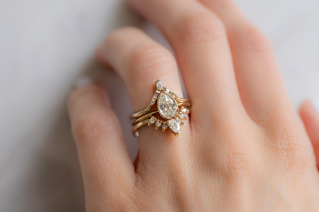 The Hazel Ring with an Old Mine Cut Diamond with Stacking Bands on Model