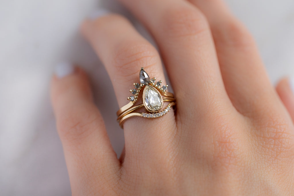 The Hazel Ring with an Old Mine Cut Diamond with Stacking Bands on Model