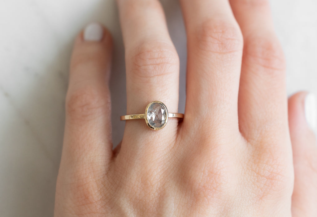 The Hazel Ring with an Oval-Cut Salt and Pepper Diamond on Model