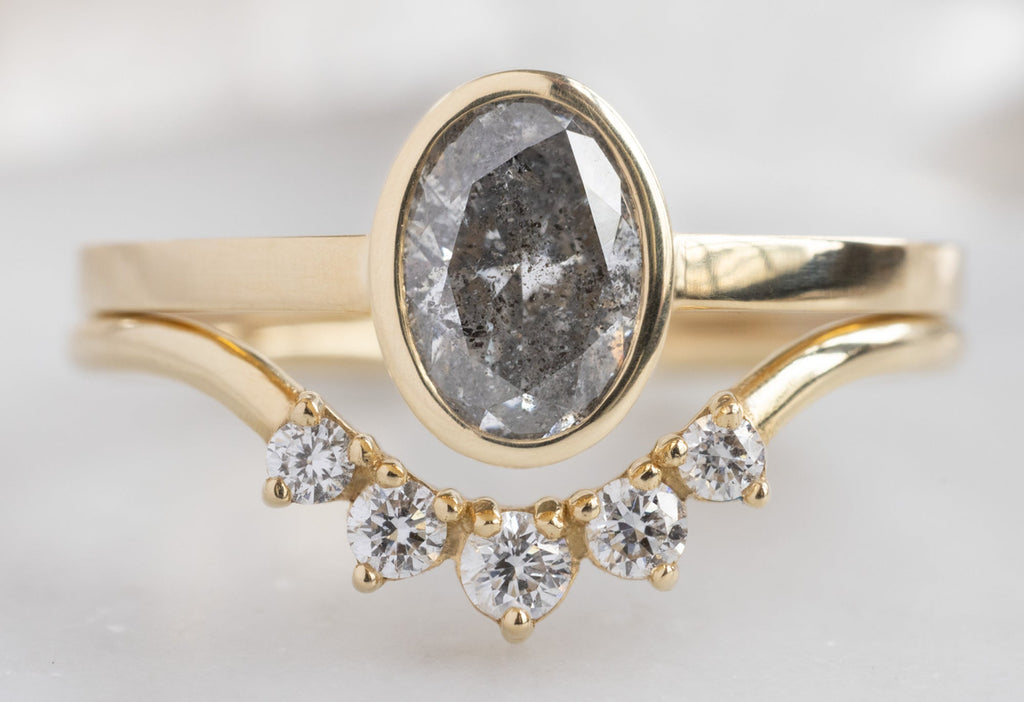 The Hazel Ring with an Oval-Cut Salt and Pepper Diamond with Round Diamond Sunburst Stacking Band