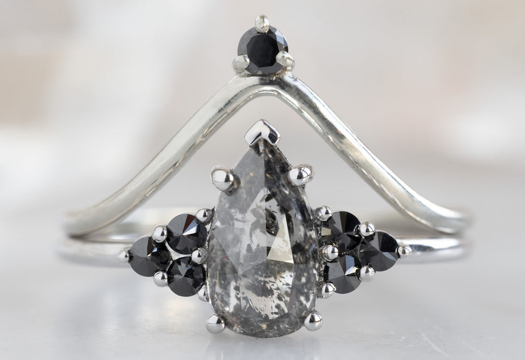The Ivy Ring with a Black Pear-Shaped Diamond with Black Diamond Stacking Band