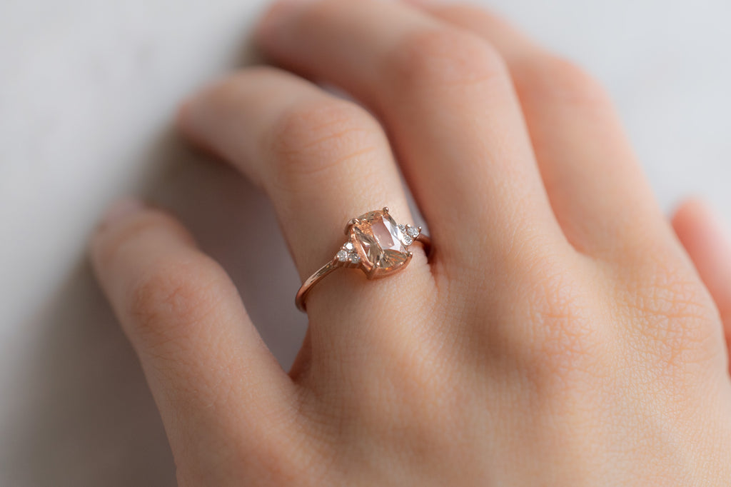 The Ivy Ring with a Cushion-Cut Peach Sapphire on Model