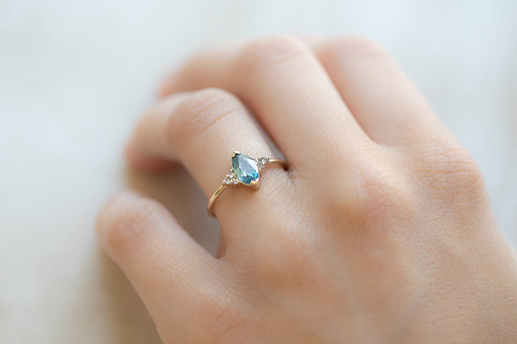 The Ivy Ring with a Marquise Sapphire on hand