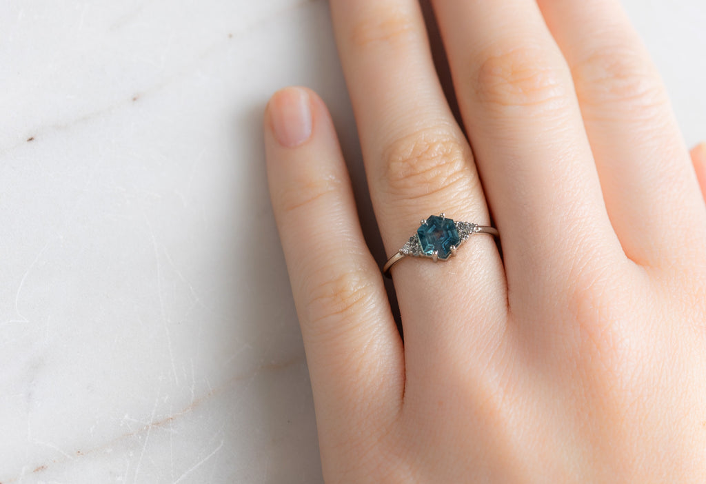The Ivy Ring with a Montana Sapphire Hexagon on Model