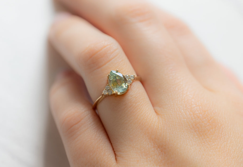 The Ivy Ring with a Pear-Cut Bicolor Sapphire on Model