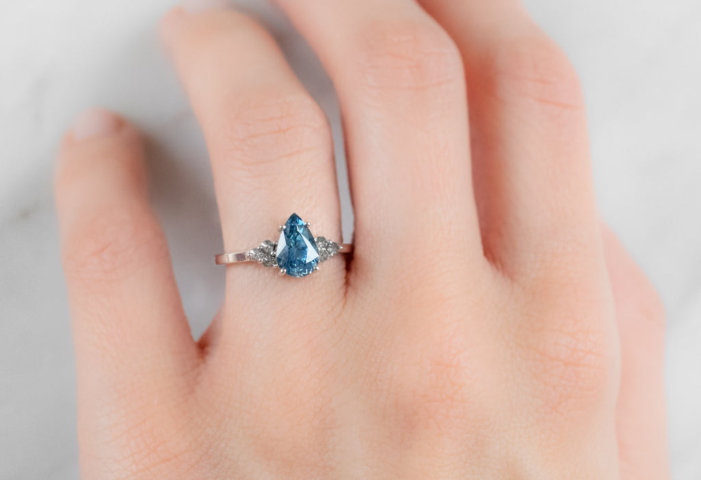 The Ivy Ring with a Pear-Cut Montana Sapphire  on Model
