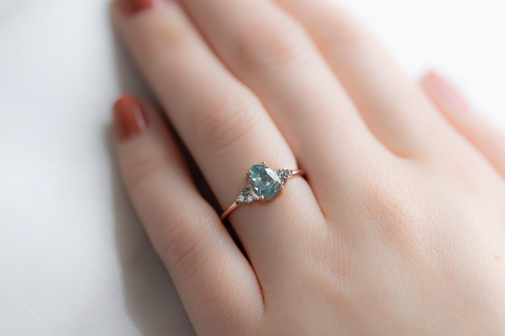 The Ivy Ring with a Pear-Cut Montana Sapphire on Model