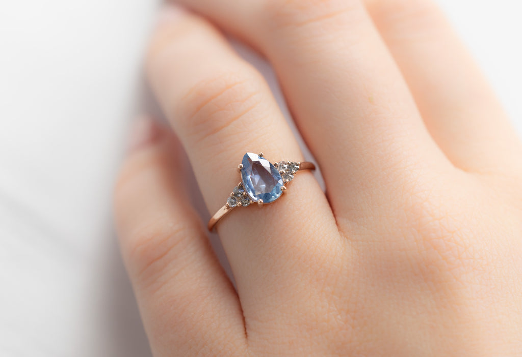The Ivy Ring with a Pear-Cut Montana Sapphire on Model
