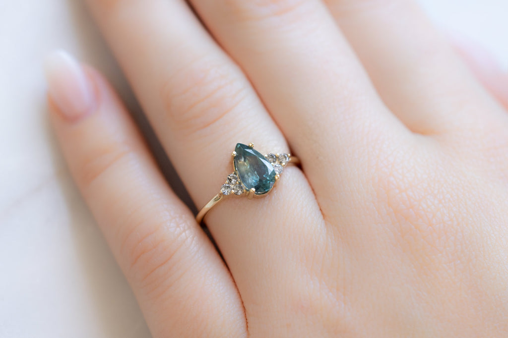 The Ivy Ring with a Pear-Cut Montana Sapphire on Model